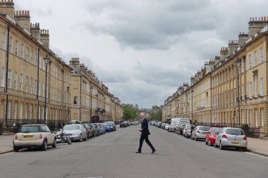 Bath, UK - May 9, 2018: View of Great Pulteney Street. The city of Bath is a famous tourist destination with around 4 million visitors a year.