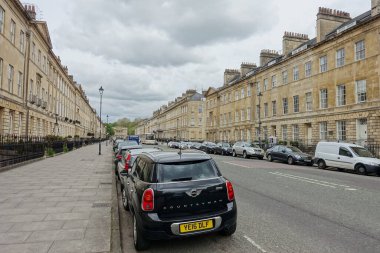 Bath, UK - May 9, 2018: View of Great Pulteney Street. The city of Bath is a famous tourist destination with around 4 million visitors a year.