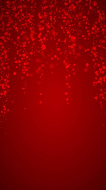 Sihirli kar yağışı arkaplanı. İnce uçan kar taneleri ve kırmızı arka plandaki yıldızlar. Sihirli yağan kar tatili manzarası. Dikey vektör illüstrasyonu.