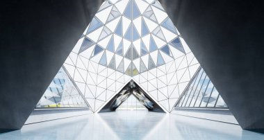 Çağdaş üçgen şekil tasarımı modern mimari bina içi cam, beton ve çelik elementlerle kaplı. 3B görüntüleme.