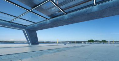 Perspective view of empty concrete floor and modern rooftop building. 3d rendering