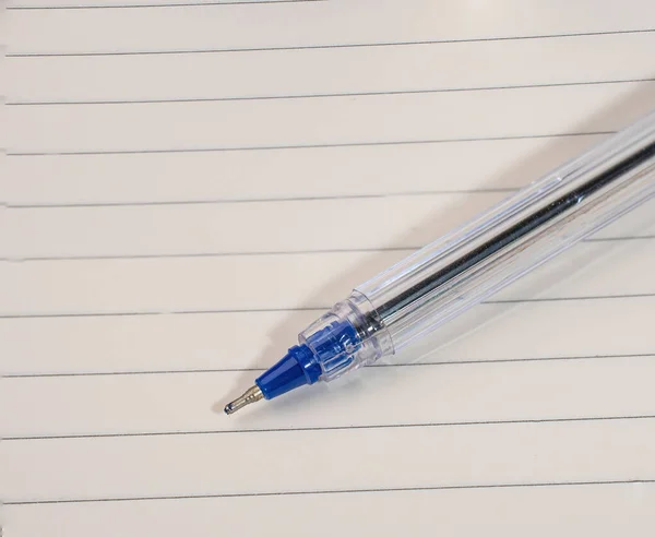 White notebook with lines can and pen. High quality photo