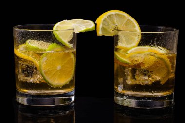 lemonade with lemon slices on a Black background . High quality photo