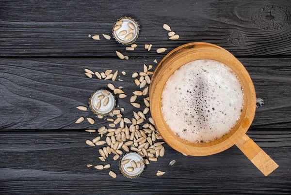 top view, on a cup with beer and seeds. High quality photo