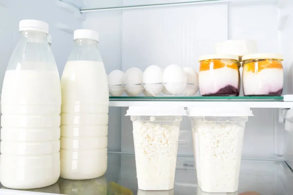 farm dairy products on the shelf in the refrigerator