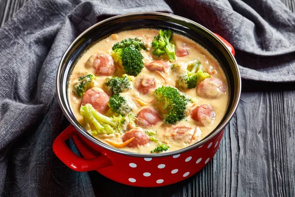 Delicious Cheesy Broccoli Kielbasa Soup Pot Black Wood Table Horizontal — Stok Foto