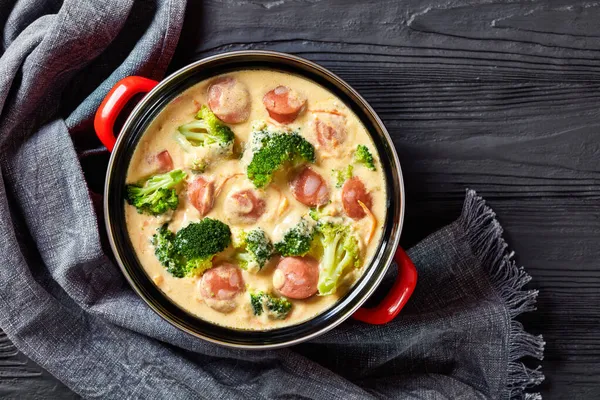 Spicy Broccoli Cheddar Sausage Soup Red Pot Black Wooden Table — Stock Photo, Image