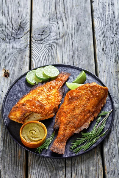 Two Roasted Sea Perches Plate Rosemary Lime Slices Vertical View — Stockfoto