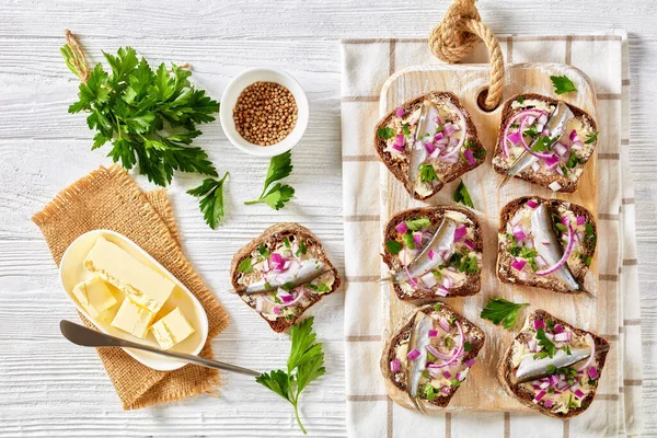 Pickled Sprat Open Sandwiches Butter Red Onion Rye Bread Slices — стоковое фото