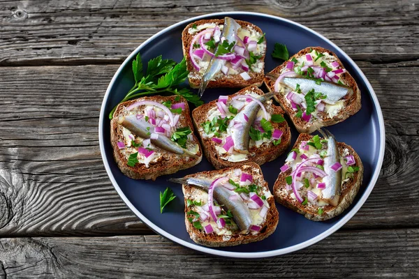 Pickled Sprat Open Sandwiches Butter Red Onion Rye Bread Slices — стоковое фото