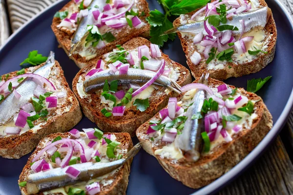 Close Marinated Sprat Open Sandwiches Butter Red Onion Rye Bread — стоковое фото
