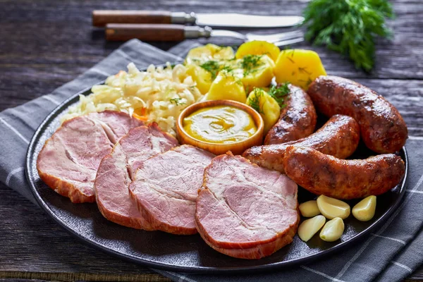 Fried Bratwurst Smoked Pork Neck Boiled Potatoes Sauerkraut Mustard Black — Stock Photo, Image