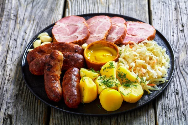 Close Schlachtplatte Fried Bratwurst Smoked Pork Neck Boiled Potatoes Sauerkraut — Stock Photo, Image