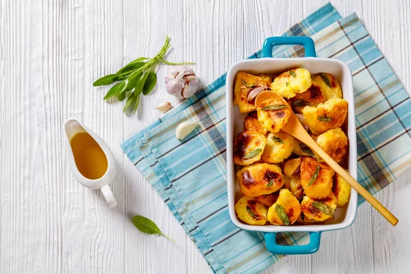 Crispy Roasted Squashed Potatoes Caramelised Garlic Sage Leaves Baking Dish — Stock Photo, Image