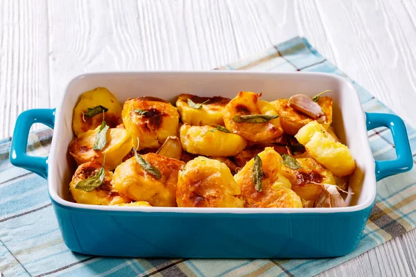 Crispy Roasted Squashed Potatoes Caramelised Garlic Sage Leaves Baking Dish — Stock Photo, Image