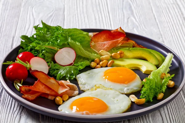 Fried Eggs Fresh Crispy Lettuce Avocado Slices Red Radishes Roasted — Fotografia de Stock