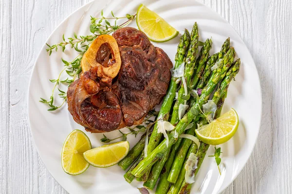 Braised Osso Buco Veal Shank Steak Grilled Asparagus Lime Swiss — Stock Photo, Image