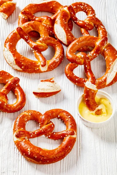 Soft Pretzels Baked Form Knot Sprinkled Salt White Wooden Table — Stok fotoğraf