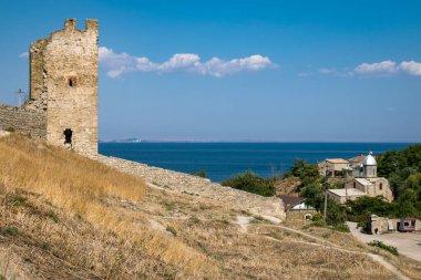Tower of Crisco (Genoese fortress) and the church of the Iveron icon of the Mother of God in Crimea, Feodosia clipart
