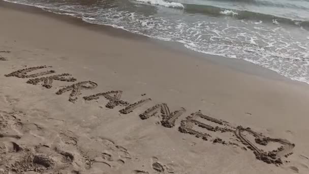 Ucraina scritto a mano nella sabbia — Video Stock