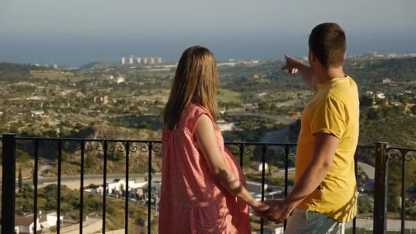 Couple Spending Time Together Standing Elevated Observation Deck Man Points — Video Stock