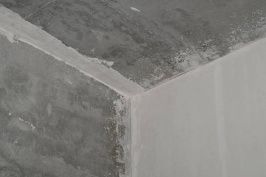 Tavan ve duvarlar arasındaki köşe. İç yapı. Yenileme işlemi. beton yüzey