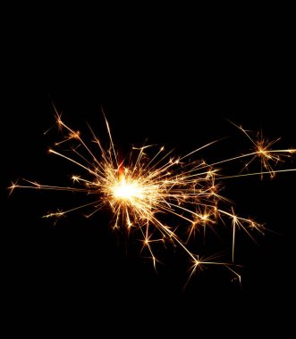 Christmas sparkler Isolated On Black. Fuse Burning.