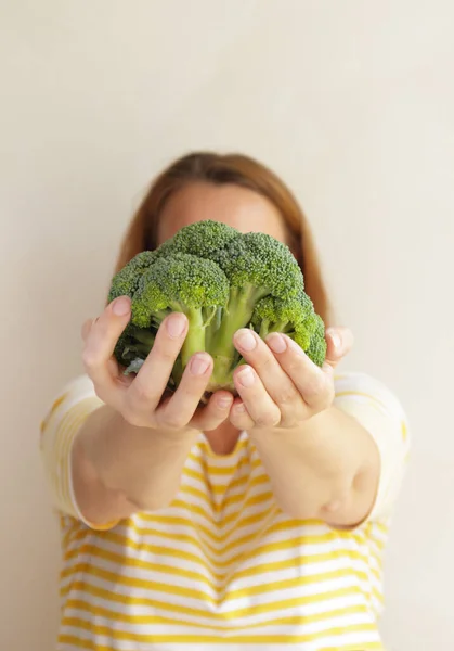 Woman Covers Her Face Fresh Green Broccoli Selective Focus — Stock Photo, Image