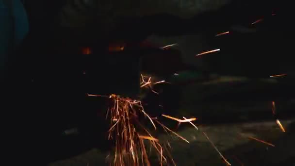 Man Works Grinder Workshop Spitting Out Sparks — Stock Video