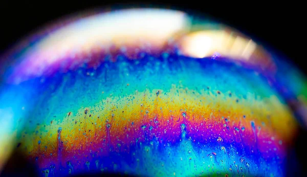 Абстрактний візерунок, різнокольорова хаотична текстура всередині мильної бульбашки, крупним планом — стокове фото