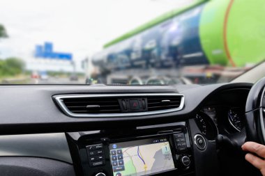 car interior view from angle of driver on motorway