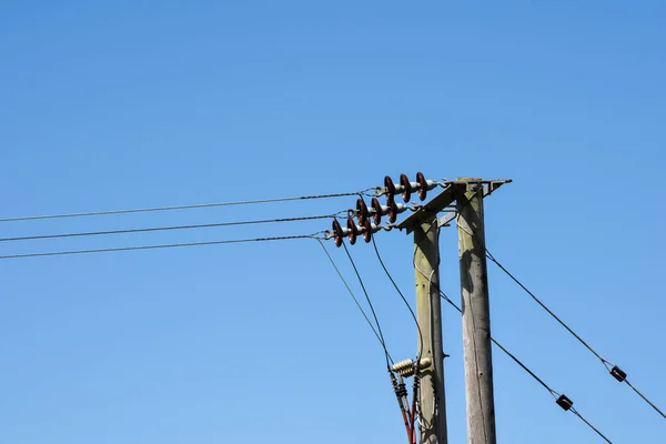 Power lines on blue sky background