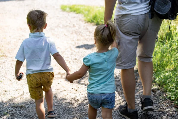 Backview Man Walking Alone Lane Park Children Holding Daughter Hand — Foto Stock