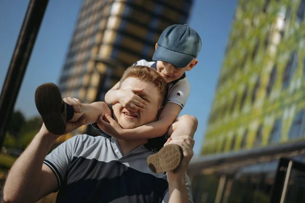 Boy Sitting Father Shoulders Closing His Eyes Hands Having Fun — Foto Stock