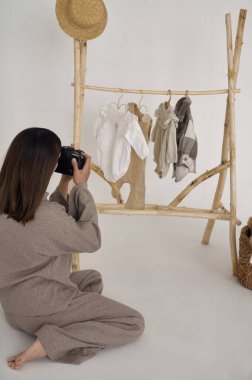 young beautiful designer takes pictures of her work