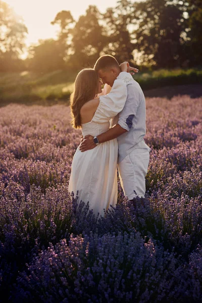 Young Beautiful Pregnant Couple Walking Lavender Field Sunset Happy Family — Zdjęcie stockowe