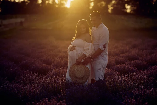 Young Beautiful Pregnant Couple Walking Lavender Field Sunset Happy Family — Stock fotografie