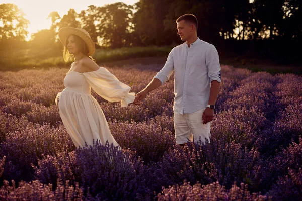 Young Beautiful Pregnant Couple Walking Lavender Field Sunset Happy Family — Fotografia de Stock