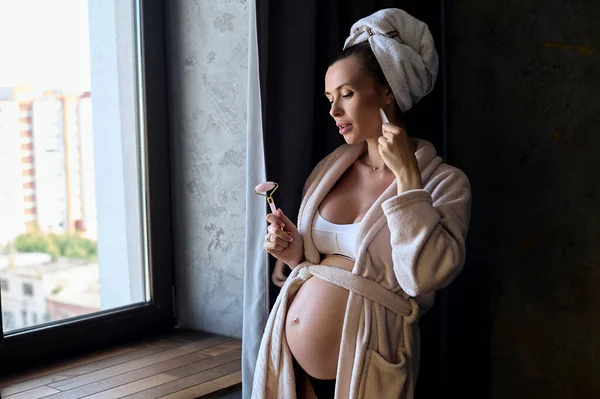 Portrait Beautiful Pregnant Woman Bathrobe Towel Making Beauty Face Massage — Fotografia de Stock