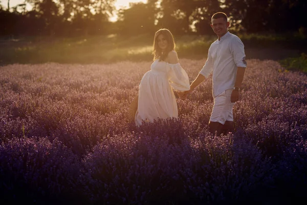 Young Beautiful Pregnant Couple Walking Lavender Field Sunset Happy Family — Stok fotoğraf