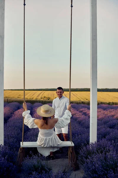 Young Beautiful Pregnant Couple Swing Lavender Field Sunset — Foto Stock