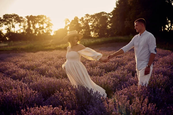 Young Beautiful Pregnant Couple Walking Lavender Field Sunset Happy Family — Stok fotoğraf