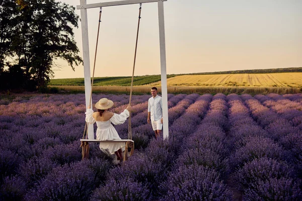 Young Beautiful Pregnant Couple Swing Lavender Field Sunset — Fotografia de Stock