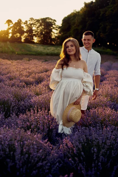 Young Beautiful Pregnant Couple Walking Lavender Field Sunset Happy Family — Fotografia de Stock