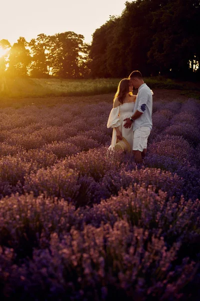 Young Beautiful Pregnant Couple Walking Lavender Field Sunset Happy Family — Stock fotografie