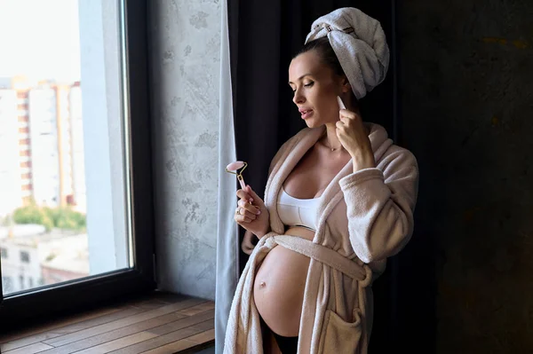 Portrait Beautiful Pregnant Woman Bathrobe Towel Making Beauty Face Massage Stok Foto