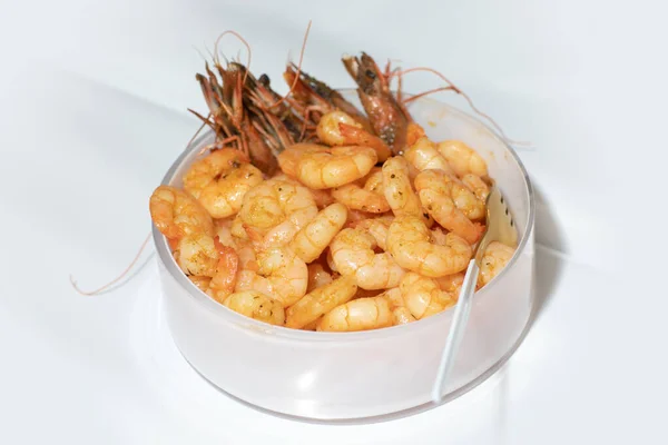 Delicious deep fried breaded shrimps served with lime wedges and coriander leaves on white plate on wooden table, copy space for text, view from above — Stock Photo, Image