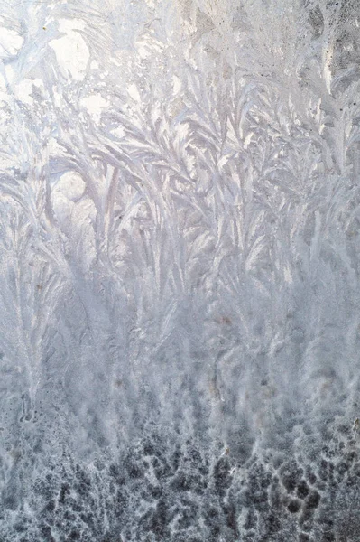 Winter pattern of frost on the window glass — Stock Photo, Image