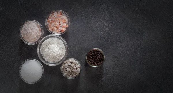 Different Types Salt Culinary Spices Glass Plates Dark Background — Stock fotografie