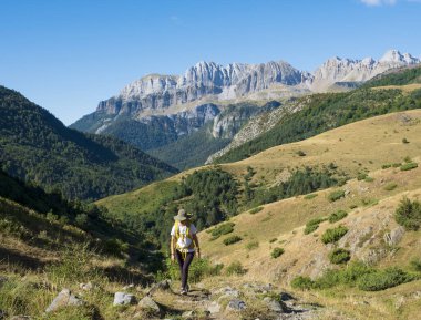 girl walking in the Pyrenees, Western Valleys Natural Park, Huesca, Spain